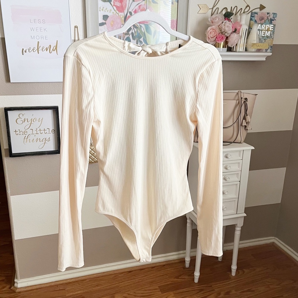 Cream long sleeve back tie bodysuit size large